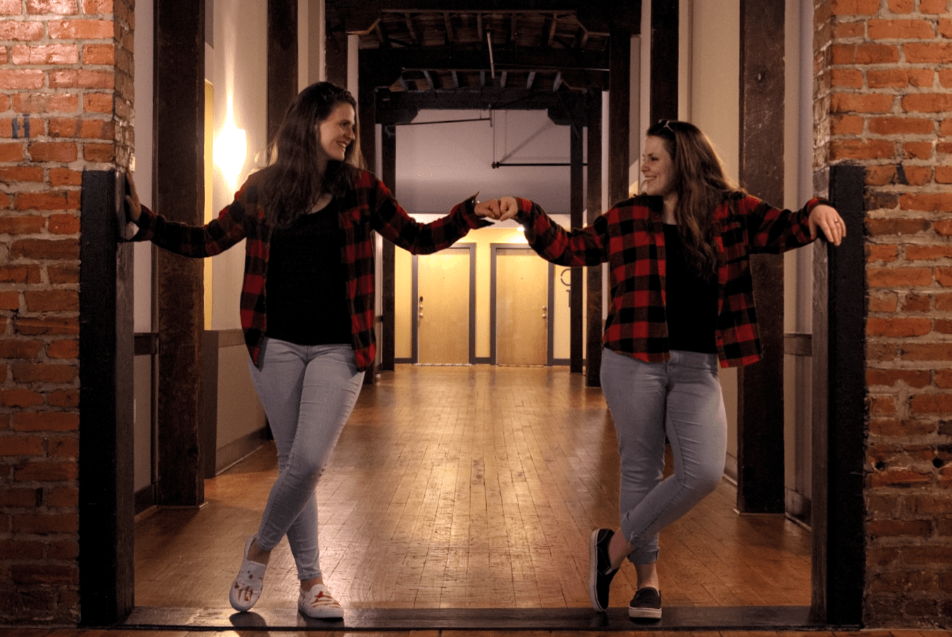 Two Friends Fist-Bumping and Smiling